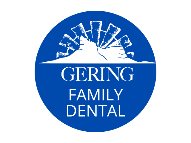 Logo of Gering Family Dental featuring stylized mountains and the text 'GERING FAMILY DENTAL' in white on a blue circular background.